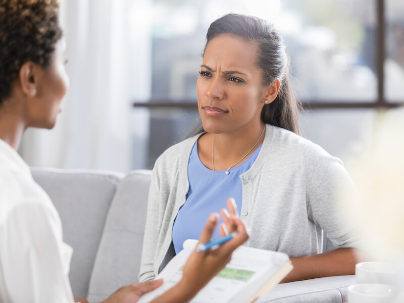 Woman confused at work because she has untreated hearing loss.