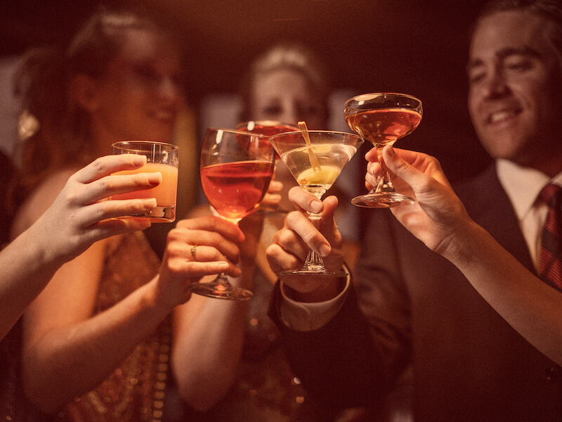 Group of older adults drinking at the bar.